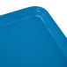 A close up of a blue rectangular Cambro tray with white lines.