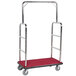 A rectangular stainless steel luggage cart with a red metal surface and chrome finish.