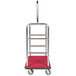 A stainless steel luggage cart with a clothing rail.