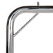A metal bar with a handle on a luggage cart.
