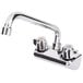A Regency chrome wall mount faucet with two handles and a 10" swing spout.