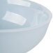 A light blue melamine bowl with a white rim.