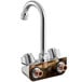 A Regency chrome wall mount faucet with copper fittings and a swivel gooseneck spout.