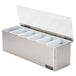 A stainless steel San Jamar condiment bar with white plastic containers.