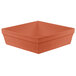 A square brown cast aluminum bowl with a copper finish.