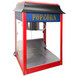 A red and blue Paragon 1911 Original Popcorn Machine with a red lid.