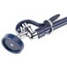 A T&S pet grooming faucet with a blue and silver hose and vacuum breaker.