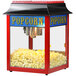A red and black Paragon 1911 Original popcorn machine.