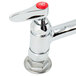 A chrome T&S pet grooming faucet with a red button on top.