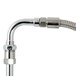 A T&S chrome deck mount pet grooming faucet with a hose attached.