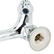 A chrome T&S wall mount pet grooming faucet with angled spray valve.