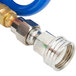 A blue coiled polyurethane hose with white connectors on each end.