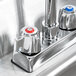 A stainless steel Eagle Group hand sink with a gooseneck faucet over a counter.