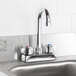 A stainless steel Eagle Group hand sink with a gooseneck faucet over the sink.