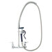 A chrome T&S pet grooming faucet with a hose.