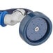 A blue and silver wheel with a white handle on a blue and white plastic shower head with a blue hose.