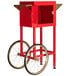 A red cart with wheels for a Carnival King PM470 Popcorn Popper.