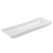 A long rectangular white plate with a curved edge.