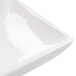 A white rectangular platter with a flared edge.