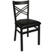 A black BFM Seating metal chair with a black cushion.