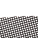 A black and white mesh Scrubble sand screen disc with a black and white grid.