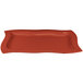 A copper rectangular serving platter with a curved edge.
