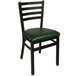 A black BFM Seating steel side chair with a green vinyl seat.