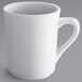 A Tuxton white china mug with a handle.