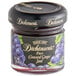 A jar of Dickinson's Pure Concord Grape Jam with a black lid.