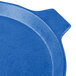 A blue round Tablecraft cast aluminum pizza tray with a handle.