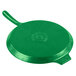 A green cast aluminum pizza tray with a handle.