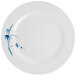 A white plate with blue bamboo leaves on it.