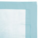 A pastel blue table cover with a white border.