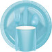 A blue table cover with a blue plate, cup, and utensils on it.