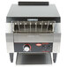 A black and silver Hatco TQ-10 Toast Qwik conveyor toaster on a counter.