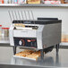 A Hatco Toast Qwik conveyor toaster with toast on a counter.