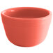 A close up of a Tuxton Cinnebar China bouillon cup with a bright orange color.