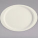 A Diamond Ivory oval platter with a round rim on a gray surface.