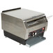 A large stainless steel Hatco conveyor toaster with a metal rack on top.