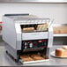 A Hatco conveyor toaster with a tray of toast.