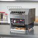 A Hatco TQ-400 Toast Qwik Conveyor Toaster with bread on the rack.