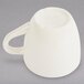 A white melamine espresso cup with a handle.