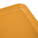 A close up of a rectangular Cambro Tuscan Gold fiberglass tray.