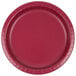 A close-up of a red Creative Converting paper plate with a thin white rim.