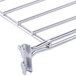 A Metro chrome wire shelf divider with metal rods.