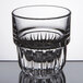 A close up of a Libbey Everest stackable juice glass with a pattern on a white table.