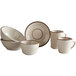 An Acopa brown speckle narrow rim stoneware bouillon cup with white dishes.