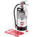 A Buckeye Class K fire extinguisher with a red tag.