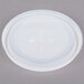 A white plastic lid with a cross in the middle.