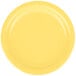 A close-up of a yellow Creative Converting paper plate.
